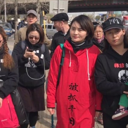 Li Wenzu (in red coat) begins her march from Beijing to Tianjian to find out what happened to her husband, Wang Quanzhang, a human rights lawyer who has been missing since August 2015. Photo: Twitter