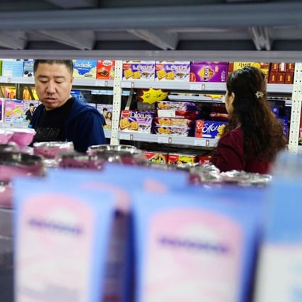A store in Qingdao, eastern China’s Shandong province. Store owners will earn 8 cents for each device connecting to the new routers. Photo: AFP
