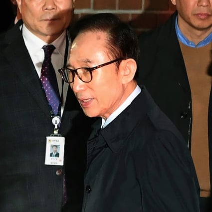 Former South Korean President Lee Myung-bak on his way to a detention centre. Photo: AP