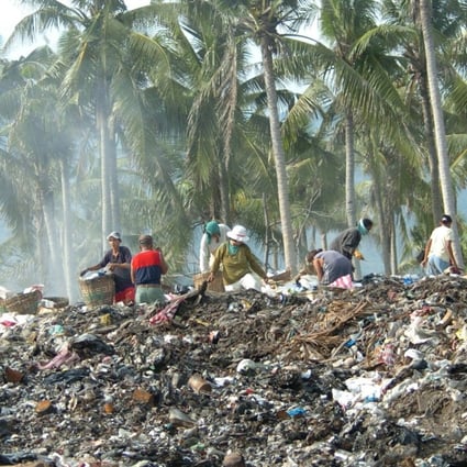 Scavengers sift through piles of garbage dumped on a hillside in the central Philippine resort island of Boracay. The worsening garbage problem on the island could threaten Boracay's image as a pristine paradise for foreign and local tourists. Photo: AFP
