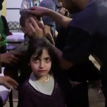 A girl gets treated after an alleged chemical weapons attack in Douma, Syria. Photo: Reuters