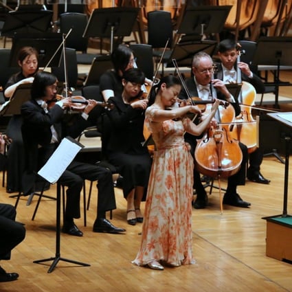 Violinist Midori performing with the Tongyeong Festival Orchestra under the baton of German conductor Christoph Eschenbach at the Hong Kong Cultural Centre Concert Hall.