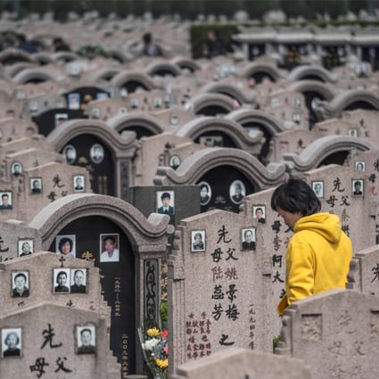 A woman pays her respects to the deceased during the Ching Ming (or Qing Ming) festival last Friday, at a cemetery in Shanghai. It is customary for Chinese people to tend to the graves of their departed loved ones during Ching Ming. Photo: AFP