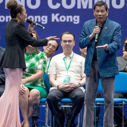 Philippine President Rodrigo Duterte sings at an event with members of the Filipino community in Hong Kong. Photo: EPA