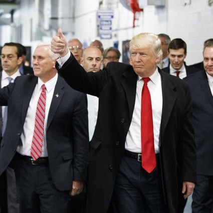 Then-President-elect Donald Trump and then-Vice-President-elect Mike Pence visit a Carrier factory in Indianapolis in December 2016. Trump has taken a tough position on trade, claiming that the policies of his predecessors have failed the American working class. Photo: AP