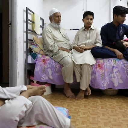 From left: Haseeb, Fazal, Ayaz, Ibrar and Sana have been waiting for public housing since 2012. They have been living in a cubicle home since 2010 because of the long wait and difficulties finding a better place. Photo: Sam Tsang