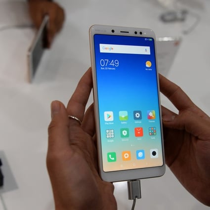 Xiaomi identified 15 test indicators which it said have been strictly implemented in production to ensure the quality of its smartphone covers. Photo: AFP