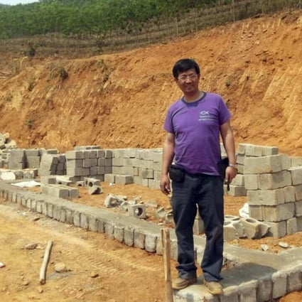 Reverend John Sanqiang Cao breaks ground on a school in Wa State, Myanmar. Photo: AP