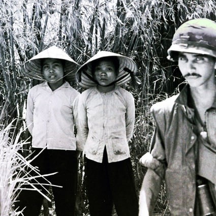 Viet Cong prisoners and American soldiers in Vietnam. Photo: Derek Maitland
