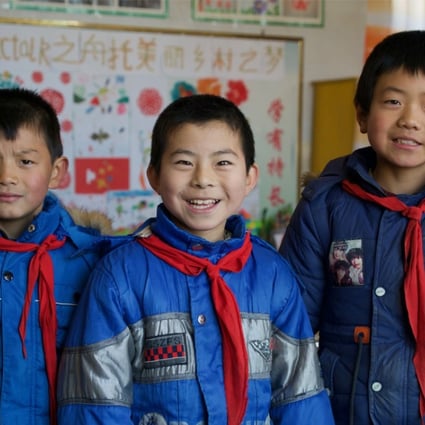 Du Yongsheng, Chang Wenxuan and Shi Zhengang, all aged 10, are the only remaining pupils at the primary school in Lumacha village, in China’s northwestern Gansu province. Photo: Tom Wang