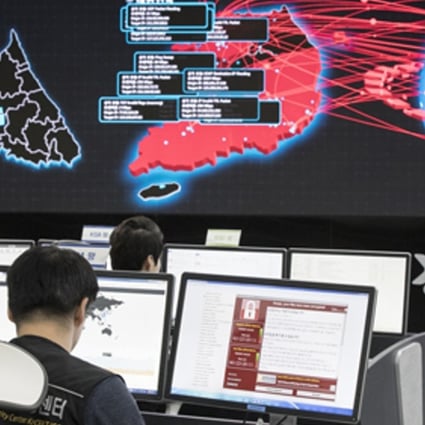 Employees watch electronic boards monitoring possible ransomware cyberattacks at the Korea Internet and Security Agency in Seoul, South Korea. Photo: Yonhap