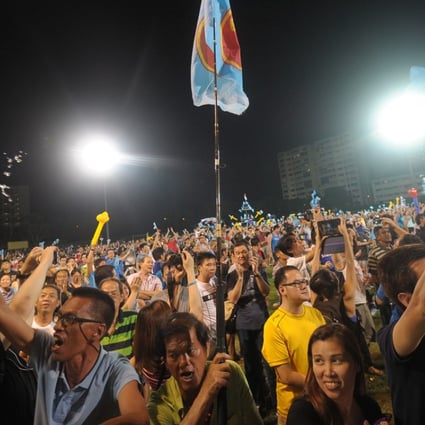 Workers Party supporters celebrate at Hougang stadium in Singapore after a general election in 2015. Photo: AFP