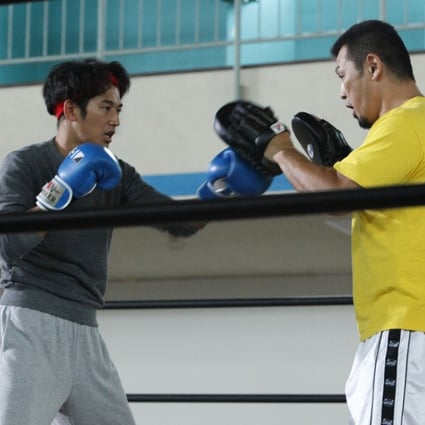 Eita (left) in a still from The Ringside Story (category IIA; Japanese), directed by Masaharu Take. It also stars Eriko Sato.