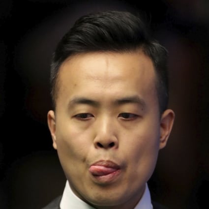 Hong Kong's Marco Fu assesses a shot against China’s Lyu Haotian at the Crucible. Photo: AP