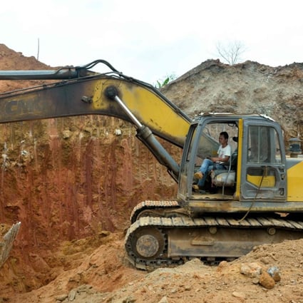 In this photograph taken on April, a Chinese employee of a mining company operates a bulldozer at a mining site in the Cameroon town of Betare Oya. Photo: Agence France-Presse