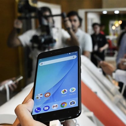 An attendee holds a Xiaomi Corp. Mi A1 dual camera device during the smartphone's launch in New Delhi, India, on Tuesday, Sept. 5, 2017. Google is teaming with China's Xiaomi to resurrect its Android One smartphone program for India, revamping a stalled effort to showcase its mobile software for users in emerging markets. Photographer: Anindito Mukherjee/Bloomberg