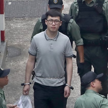 Murder suspect Keith Lau (centre with glasses) being escorted away from Lai Chi Kok Reception Centre. Photo: Edward Wong