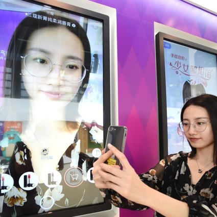 A staff member of Meitu demonstrates the company's software product. Photo: Xinhua