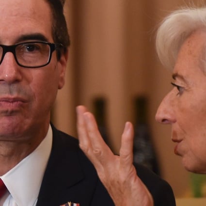 US Treasury Secretary Steven Mnuchin listens to International Monetary Fund managing director Christine Lagarde before a luncheon with French President Emmanuel Macron and US Vice-President Mike Pence, at the US State Department in Washington, on April 24. Photo: AFP
