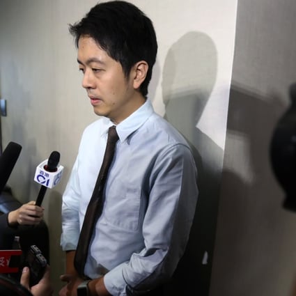 Lawmaker Ted Hui Chi-fung apologising for grabbing a government official’s phone without her consent. Photo: Nora Tam