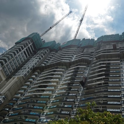 A private condominium near the business district in Singapore. A surge in en bloc purchases is boosting property prices throughout the Lion City. Photo: AFP