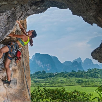 A female climber ascending the Egg, a well-known crag in Yangshuo, Guangxi province, China. Photo: Alamy
