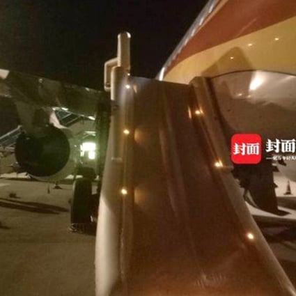 Chinese passenger pulls open escape hatch to get some fresh air while waiting on 'stuffy' plane | South China Morning Post Chinese passenger pulls open escape hatch to get some fresh air while waiting on 'stuffy' plane | South China Morning Post