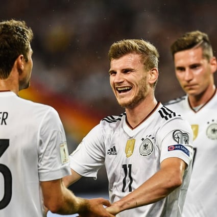 Germany’s players celebrate a goal in World Cup qualifying. Photo: EPA