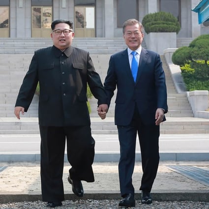 North Korean leader Kim Jong-un (left) and South Korean President Moon Jae-in walk to the Peace House building for talks in the truce village of Panmunjom on Friday. Photo: AFP / KCNA via KNS