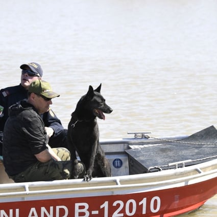 Austrian police scour Austria’s Lake Neusiedl (Neusiedler See) on April 20 after a torso was found in the water on April 13. Further body parts were found on April 16. A suspect in the case, ‘Alfred U’, was arrested, police said on Wednesday. Photo: APA via AFP