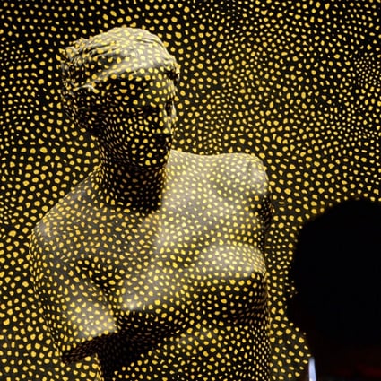 Yayoi Kusuma’s “Statue of Venus Obliterated by Infinity Nets No. 2”. Picture: AFP