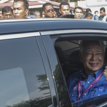 Malaysian Prime Minister Najib Razak after casting his vote. Photo: EPA