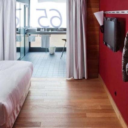 Warm woods and deep reds dominate the modern, minimalist interiors, while a quirky approach to amenities allows the Camper brand’s identity to shine through.
