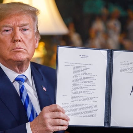 US President Donald Trump signs a memorandum declaring his intention to withdraw from the Iranian nuclear deal. Photo: Xinhua