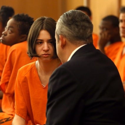 Marta San Jose consults with her lawyer Jorge L. Viera at her arraignment on July 27, 2017. San Jose is a former foreign-exchange student accused of helping her host, Dale Leary, abuse her own younger sister. She will face no charges. Photo: TNS