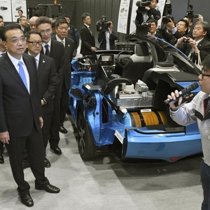 China’s premier, Li Keqiang (second from left), and Japan’s prime minister, Shinzo Abe (left), visit a Toyota factory in Tomakomai on Japan's northernmost main island of Hokkaido. Photo: Kyodo