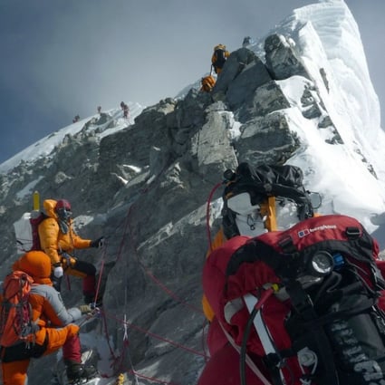 File photo of mountaineers climbing past the Hillary Step while pushing for the summit of Mount Everest. Photo: AFP