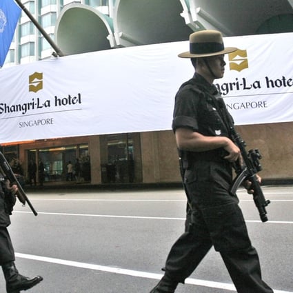 Singapore police officers patrol outside the Shangri-La hotel. Photo: AP