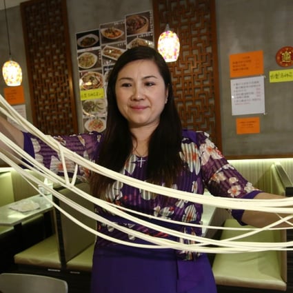 Ng Mong-ying, owner of Tin Saan Restaurant in Hong Kong, demonstrates how to make hand-pulled Xinjiang noodles. Photo: Edmond So