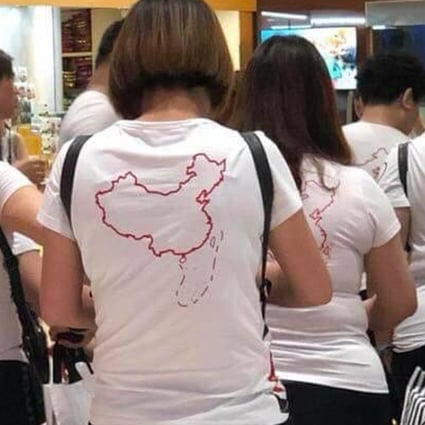 Chinese tourists in Vietnam with T-shirts depicting Beijing’s claims to the South China Sea. File photo