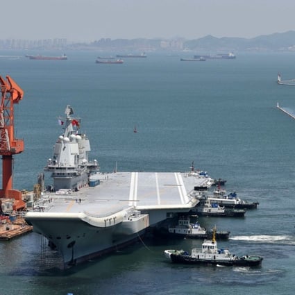 The Type 001 aircraft carrier returns to port in Dalian. Photo: Reuters