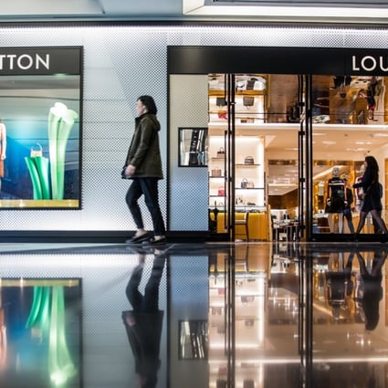 A shopper walks past a LVMH Moet Hennessy Louis Vuitton SE store at the Esentai Mall in Almaty, Kazakhstan. Louis Vuitton owner LVMH has just invested heavily in online fashion search business Lyst. Photo: Bloomberg