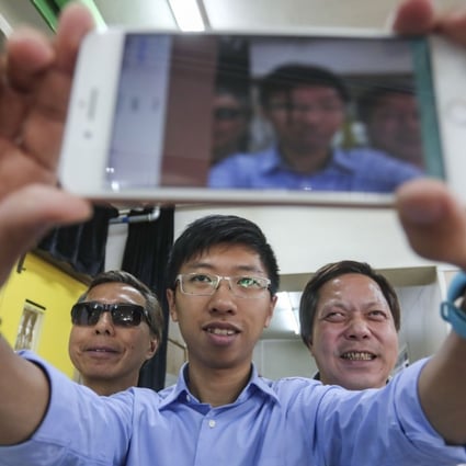 Lo Hoi (left), Michael Fung and Tang Kwong-po, chairman of the Hong Kong Federation of the Blind, which helped test the app. Photo: Jonathan Wong