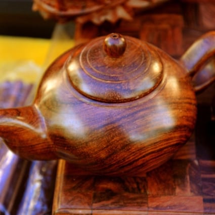 Huanghuali hardwood items such as this teapot can be found in Haikou’s stores.