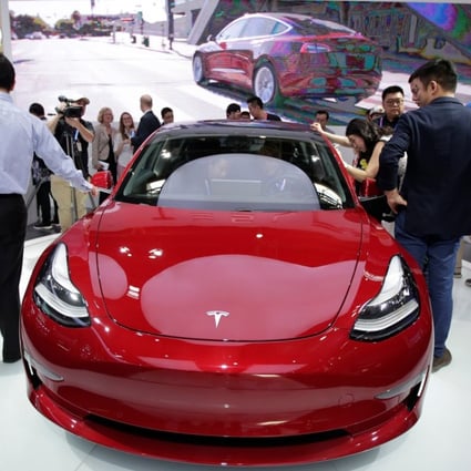 A Tesla Model 3 car is displayed during a media preview at the Auto China 2018 motor show in Beijing in April this year. The world’s fleet of electric vehicles is likely to more than triple to 13 million by the end of this decade, up from 3.7 million units last year, according to the International Energy Agency. Photo: Reuters