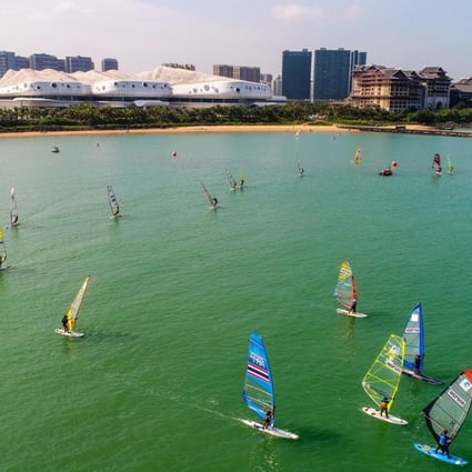Windsurfing is a popular pastime in the waters off Xixiu Beach in Haikou.