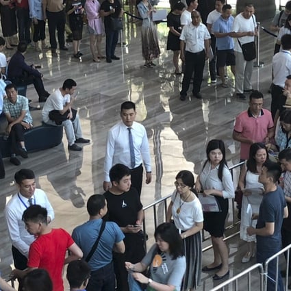 About 881 people turned up on Wednesday in the hope of getting a chance to buy one of the 167 units on sale at Shenzhen China Merchants Real Estate’s Shuangxi Garden project in Shenzhen. Photo: Pearl Liu