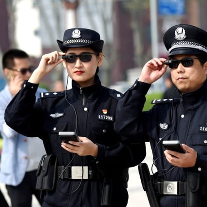 Police officers in Luoyang in Henan province wear sunglasses linked to facial recognition software that can identity fugitives. The devices are just some of the advanced surveillance technology used by police in China. Photo: Reuters