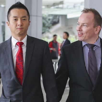 Senior immigration officer Angus Leung (left) with his partner Scott Adams. Photo: Winson Wong
