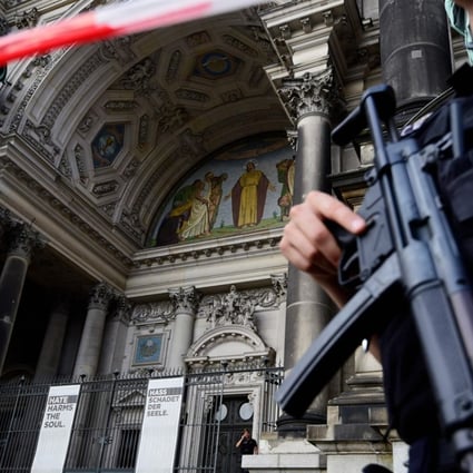 Armed Police cordon off Berling Cathedral in Berlin on Sunday after police say they shot a knife-wielding man who was “rampaging” there. Photo: AFP